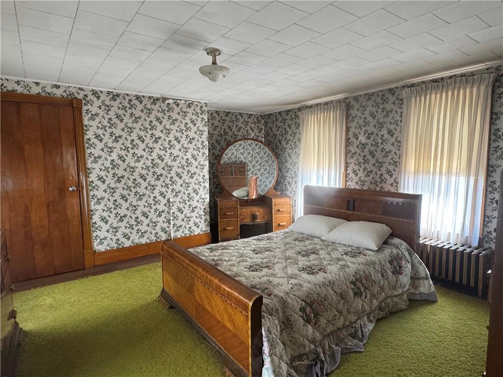 797 Walnut Hill Road Uniontown, PA 15401 - Photo 21 of 39 a bed sitting in a spacious bedroom next to a window