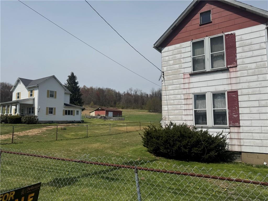 797 Walnut Hill Road Uniontown, PA 15401 - Photo 31 of 39 a front view of a house with a yard