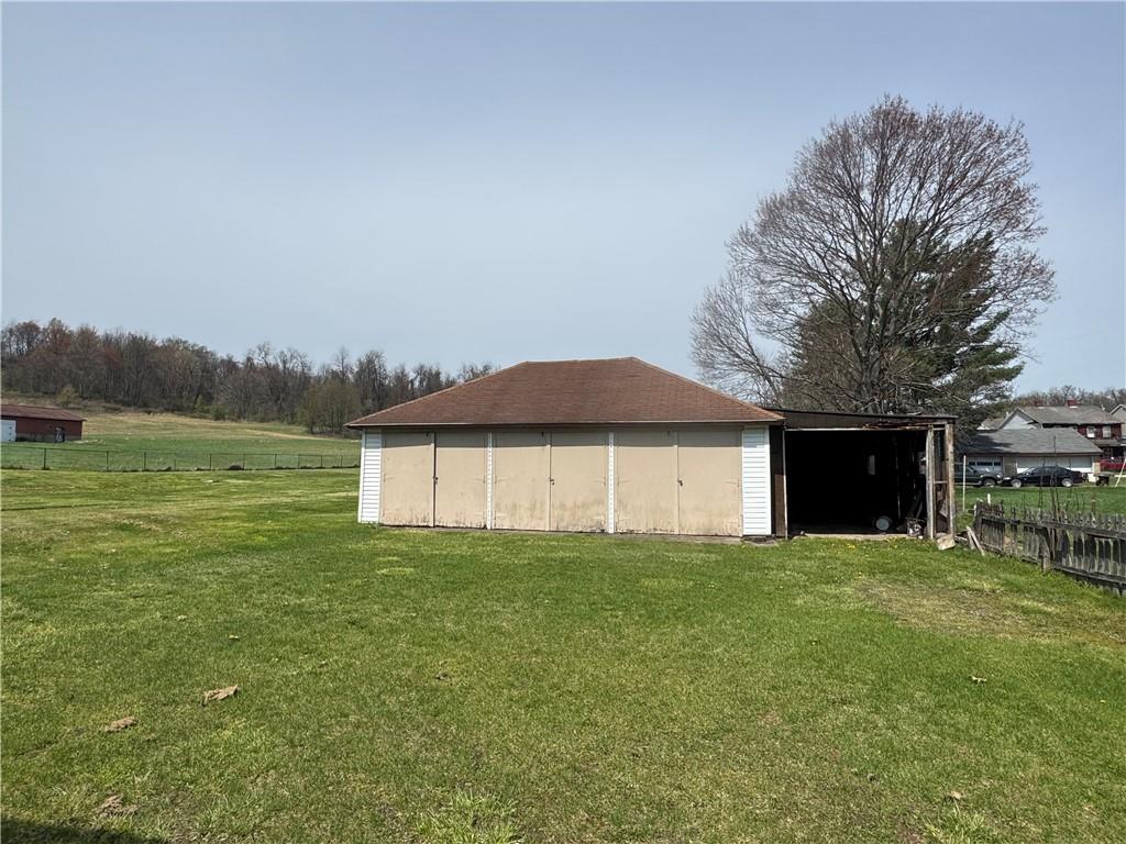 797 Walnut Hill Road Uniontown, PA 15401 - Photo 35 of 39 a view of a house with a yard and a large tree