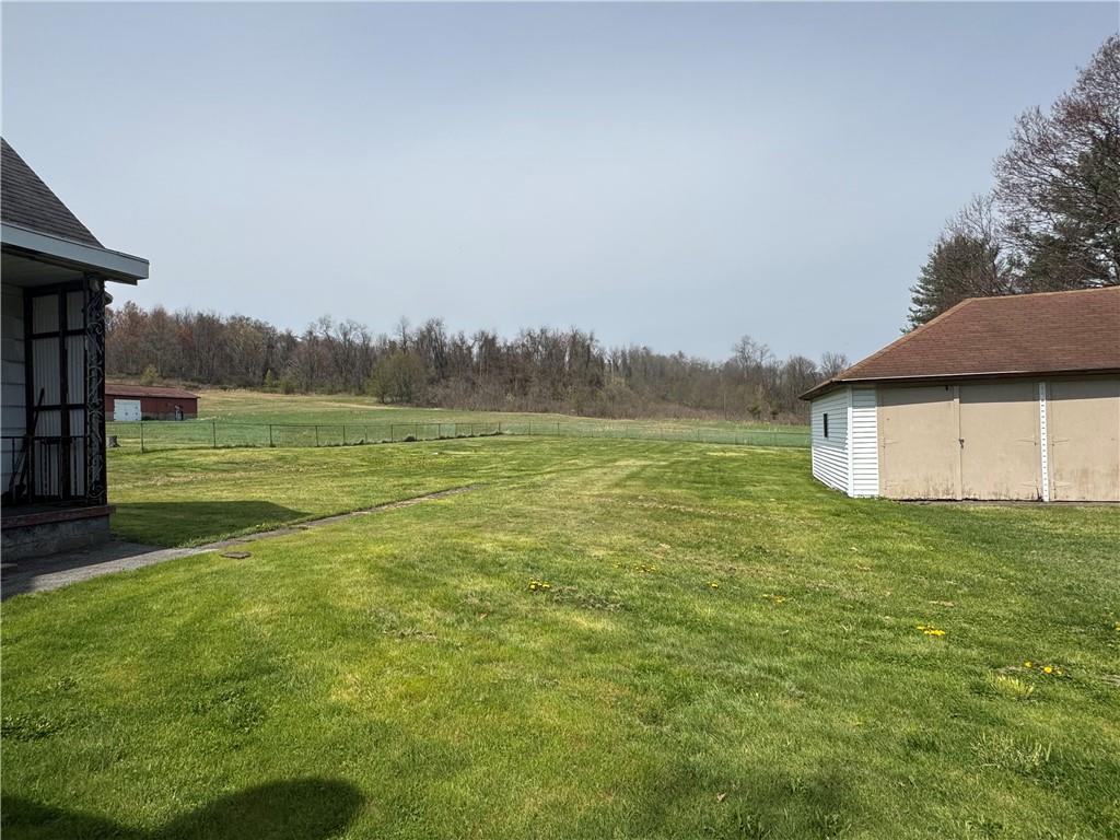 797 Walnut Hill Road Uniontown, PA 15401 - Photo 36 of 39 a view of a field with an trees in the background