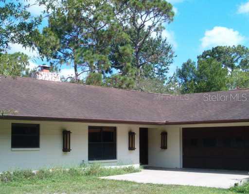 6906 Jones Road Odessa, FL 33556 - Photo 1 of 1 a backyard of a house with lots of green space