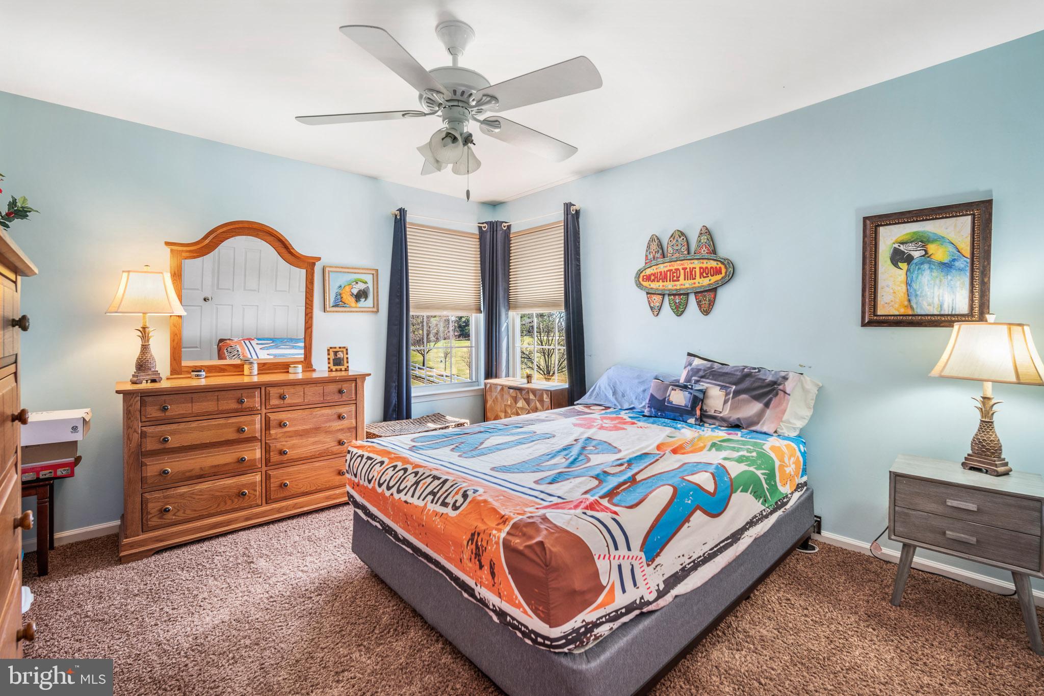 109 Brookside Way Mullica Hill, NJ 08062 - Photo 20 of 41 a bedroom with a bed and a chandelier