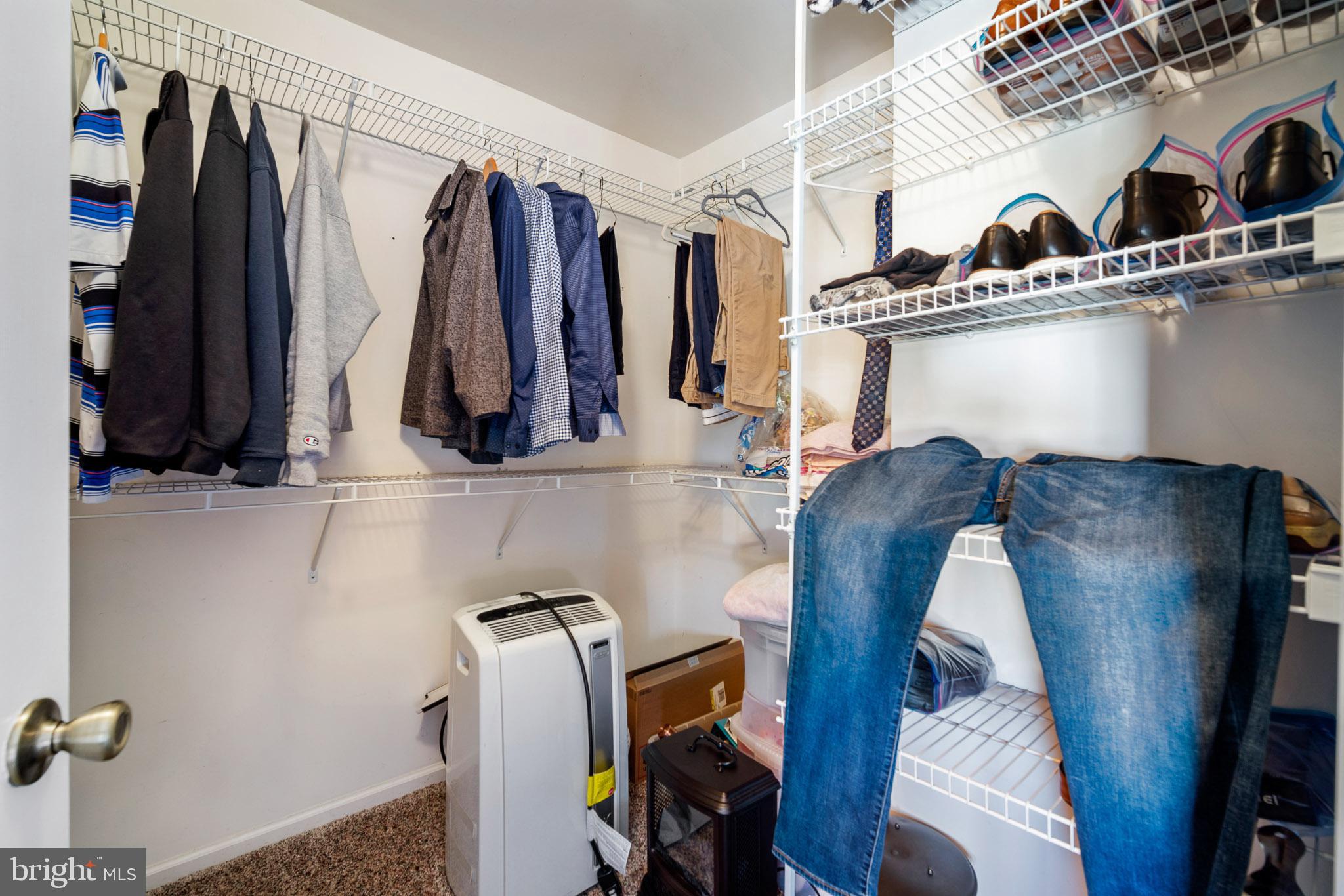 109 Brookside Way Mullica Hill, NJ 08062 - Photo 29 of 41 a view of walk in closet with clothes and shoes