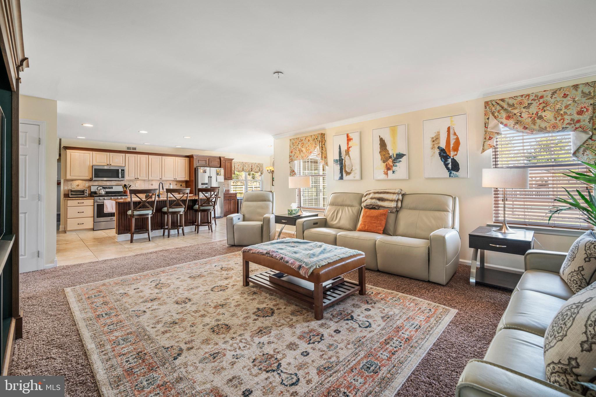 109 Brookside Way Mullica Hill, NJ 08062 - Photo 7 of 41 a living room with furniture and a dining table with wooden floor