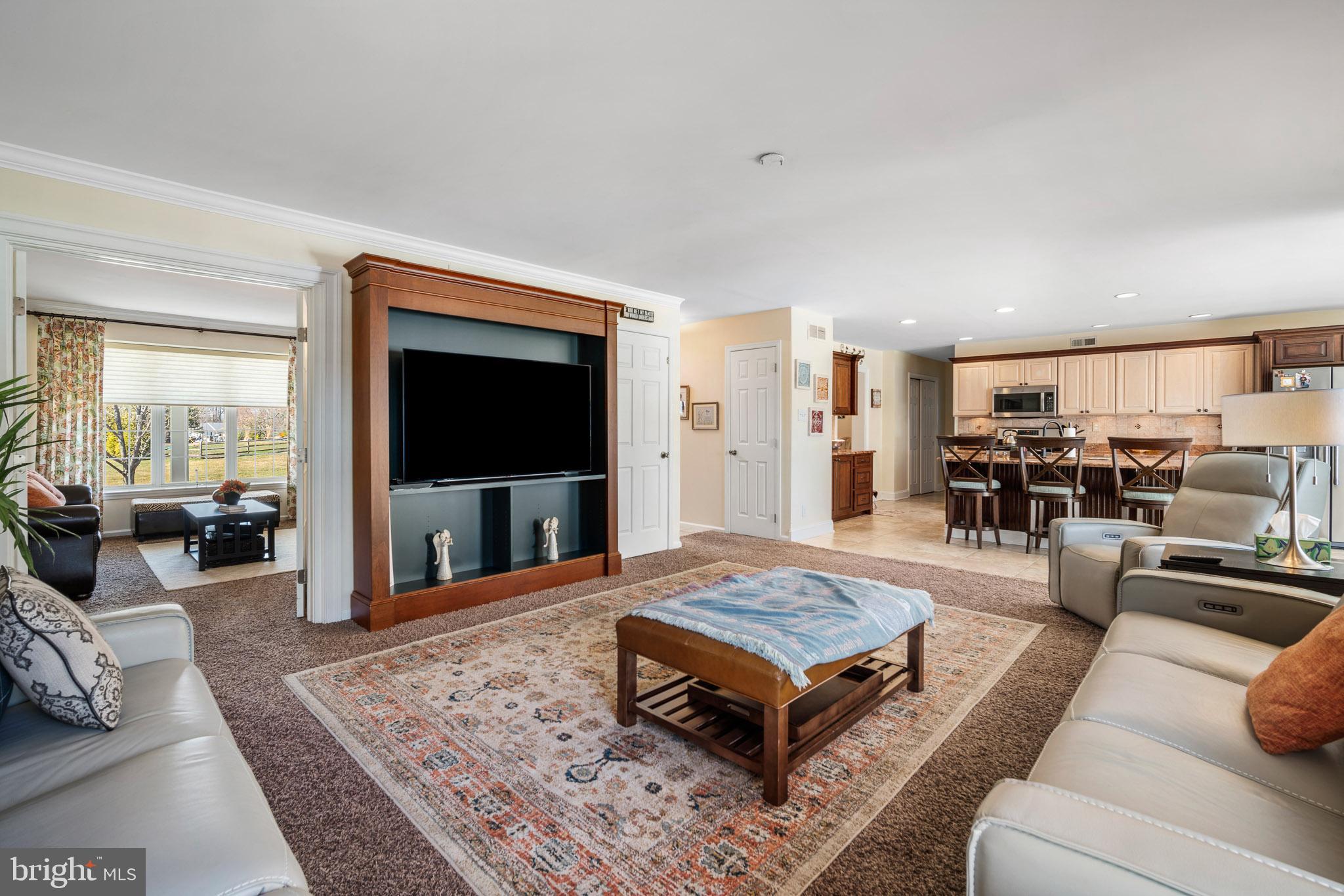 109 Brookside Way Mullica Hill, NJ 08062 - Photo 8 of 41 a living room with furniture and a flat screen tv