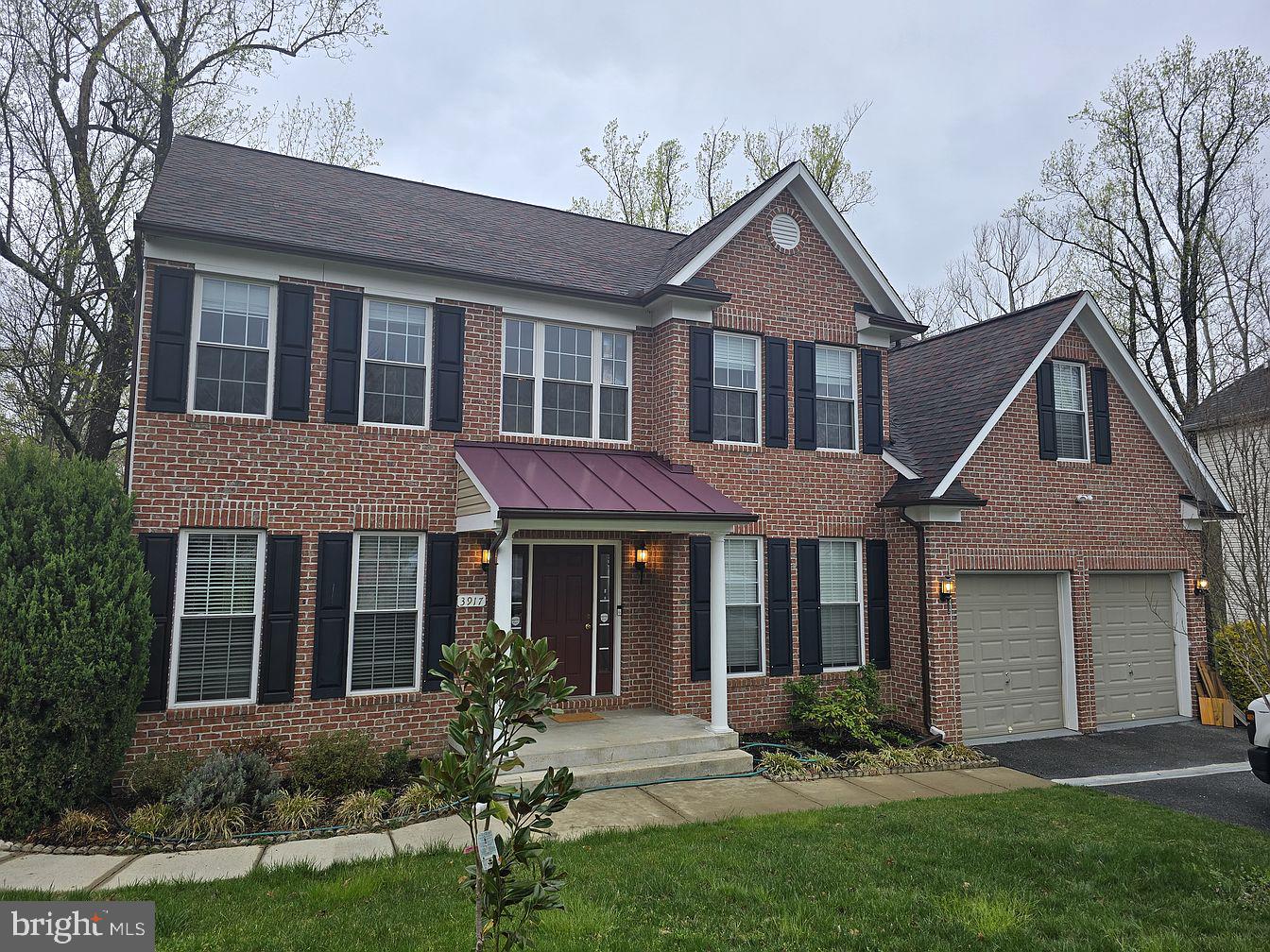 front view of a house with a yard