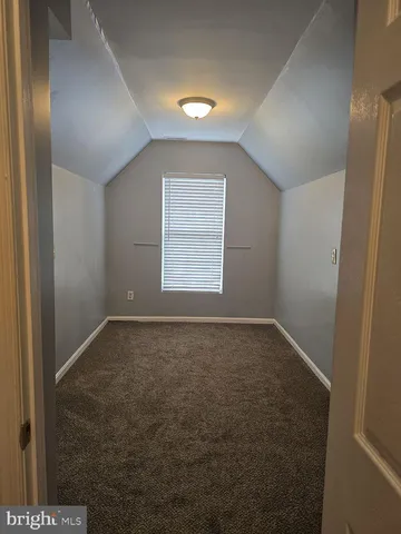 a bathroom with a double vanity sink toilet and shower