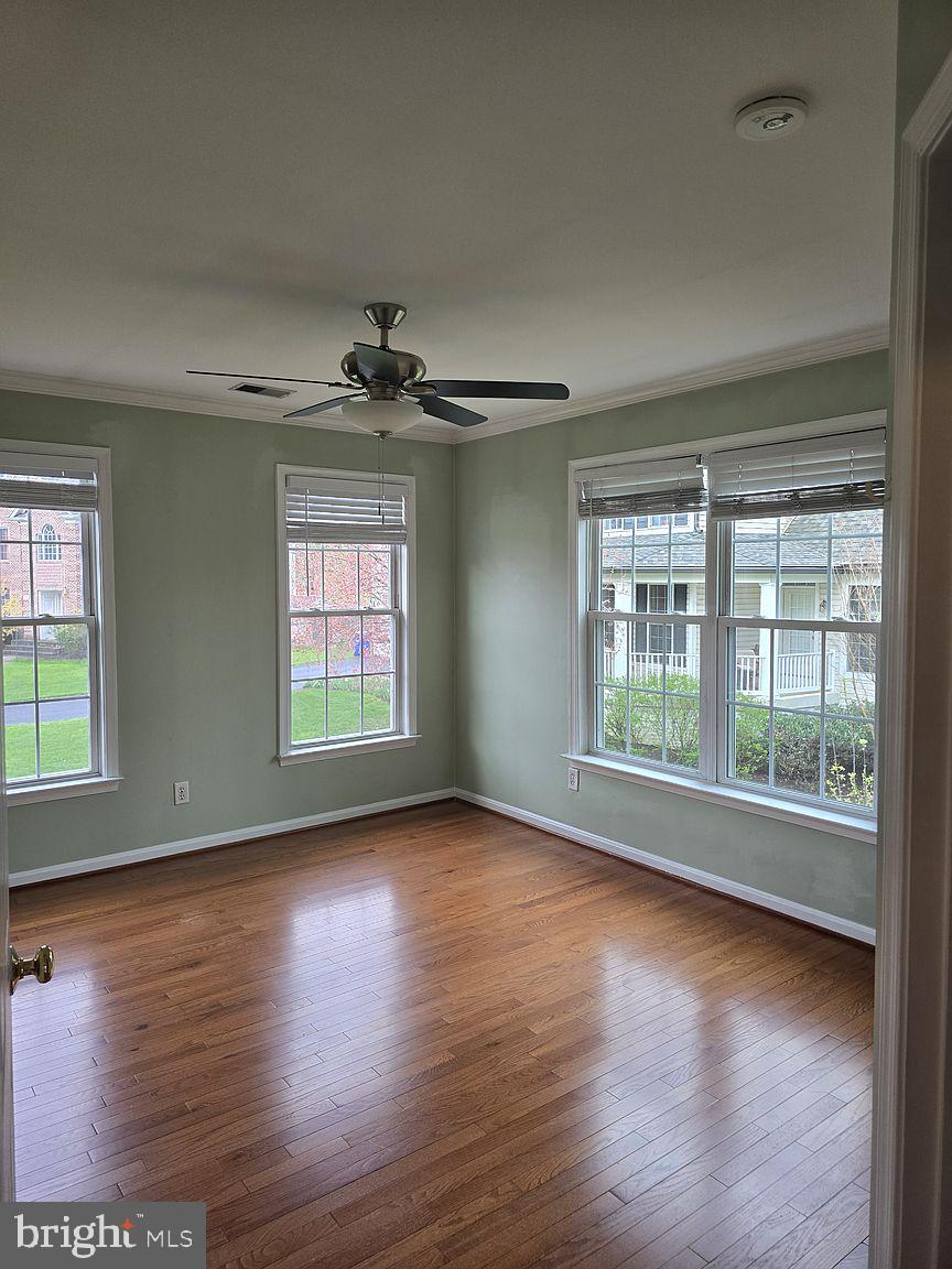 3917 Edith Court Ellicott City, MD 21043 - Photo 16 of 27 an empty room with wooden floor and windows