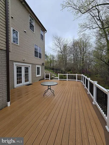 a balcony with view of the house