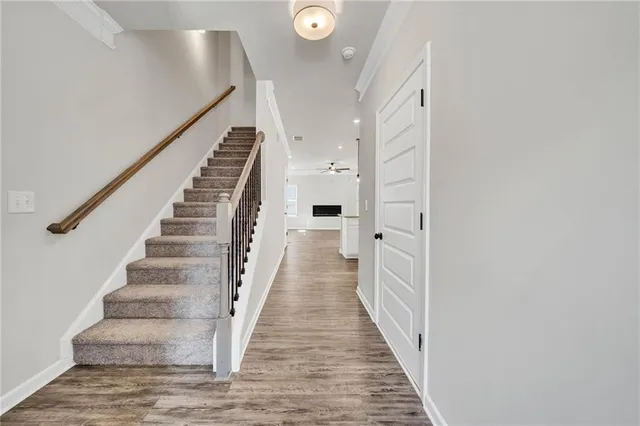 a kitchen with a sink a counter space appliances and cabinets