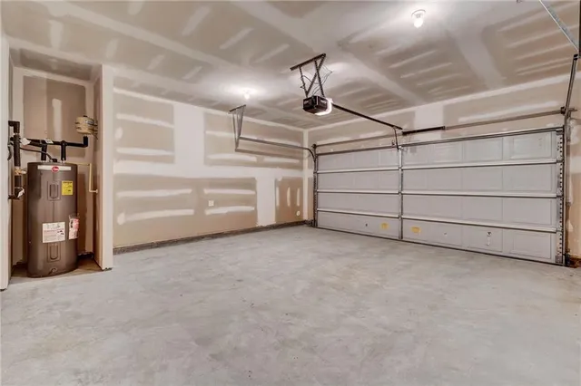 a kitchen with granite countertop cabinets stainless steel appliances and wooden floor