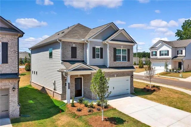 an aerial view of a house with a swimming pool