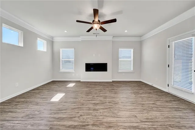 a view of an empty room with windows