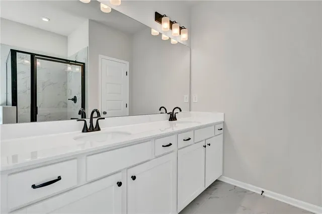 a kitchen with a sink appliances and cabinets