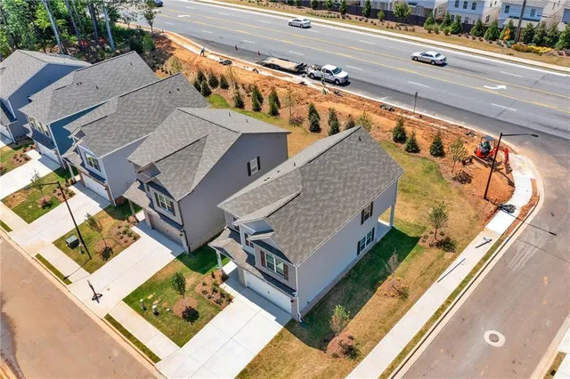 an aerial view of a house with a garden