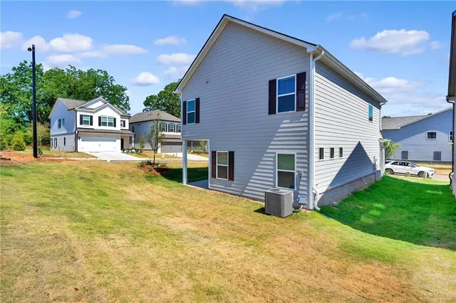 a living room with furniture and white walls