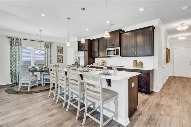 a bed room with a bed couches and a couch