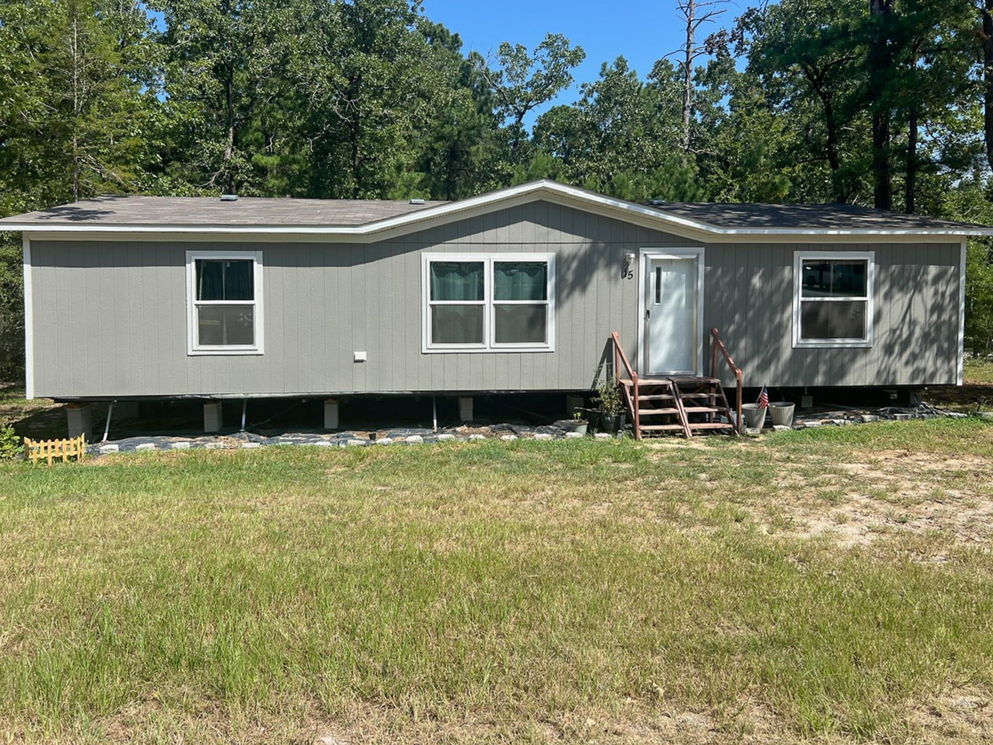 a house with trees in the background