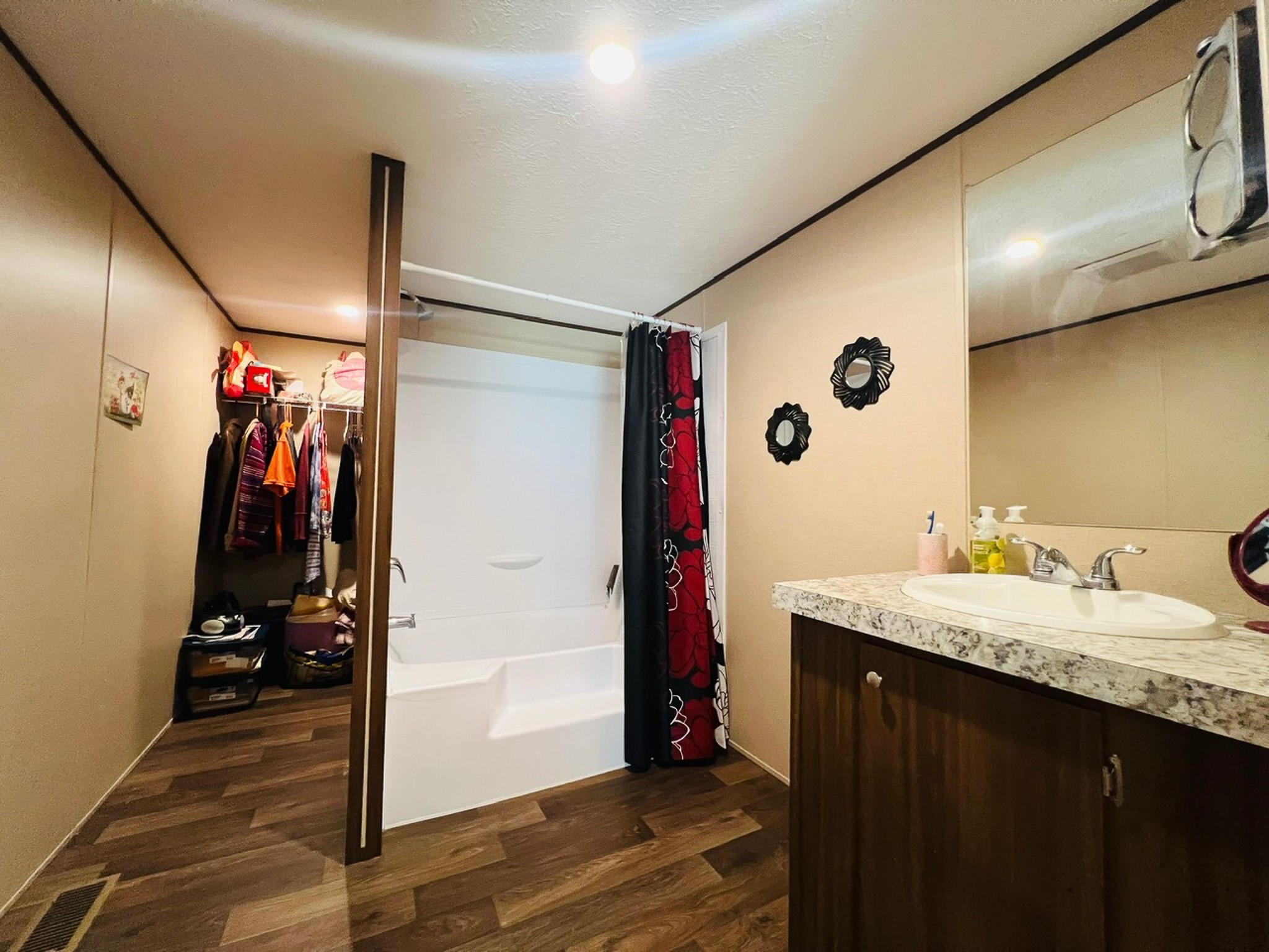 15 Great Oak Trinity, TX 75862 - Photo 11 of 13 a bathroom with a granite countertop sink a mirror and shower