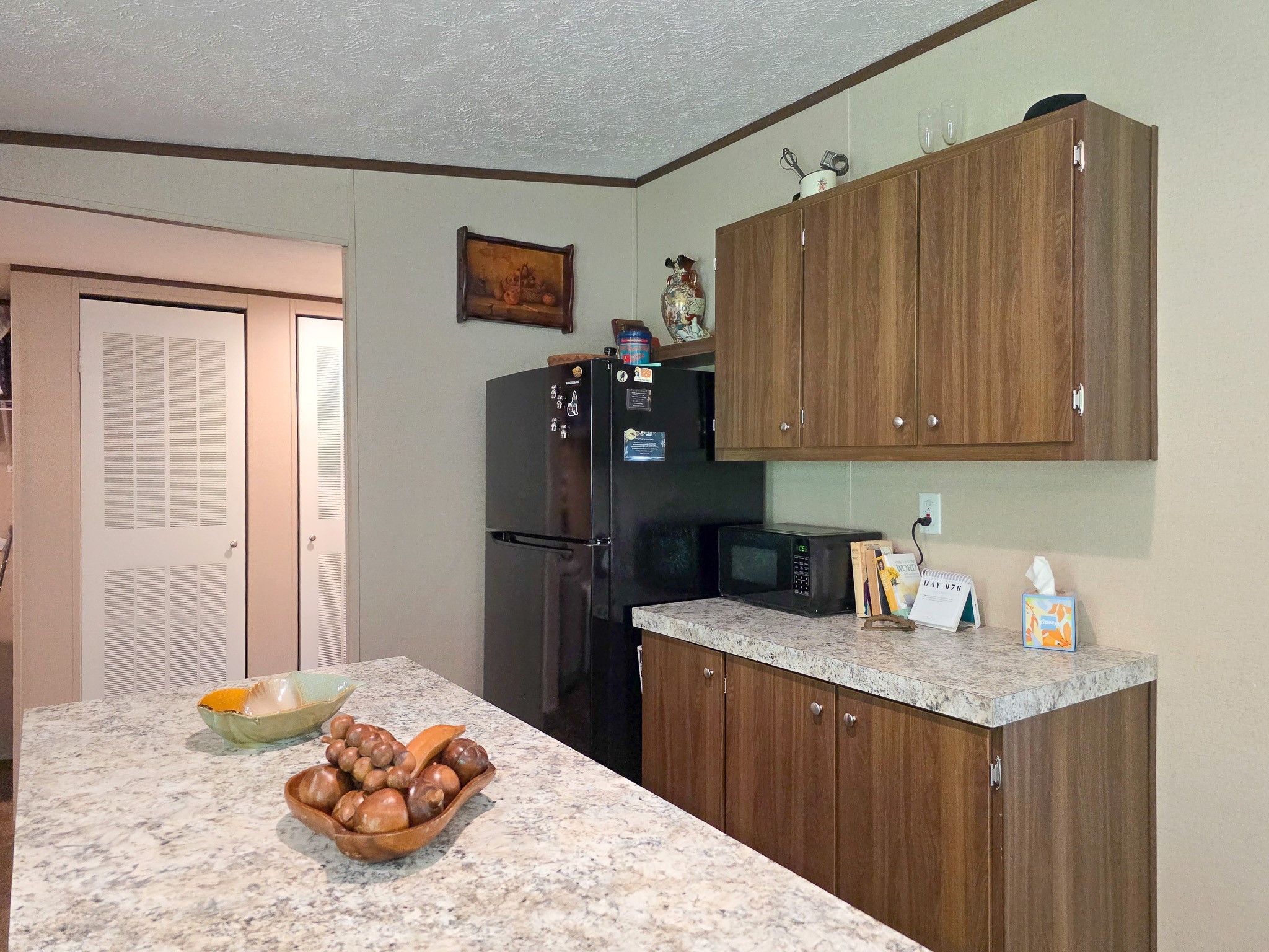 15 Great Oak Trinity, TX 75862 - Photo 6 of 13 a kitchen with stainless steel appliances granite countertop a sink refrigerator and microwave
