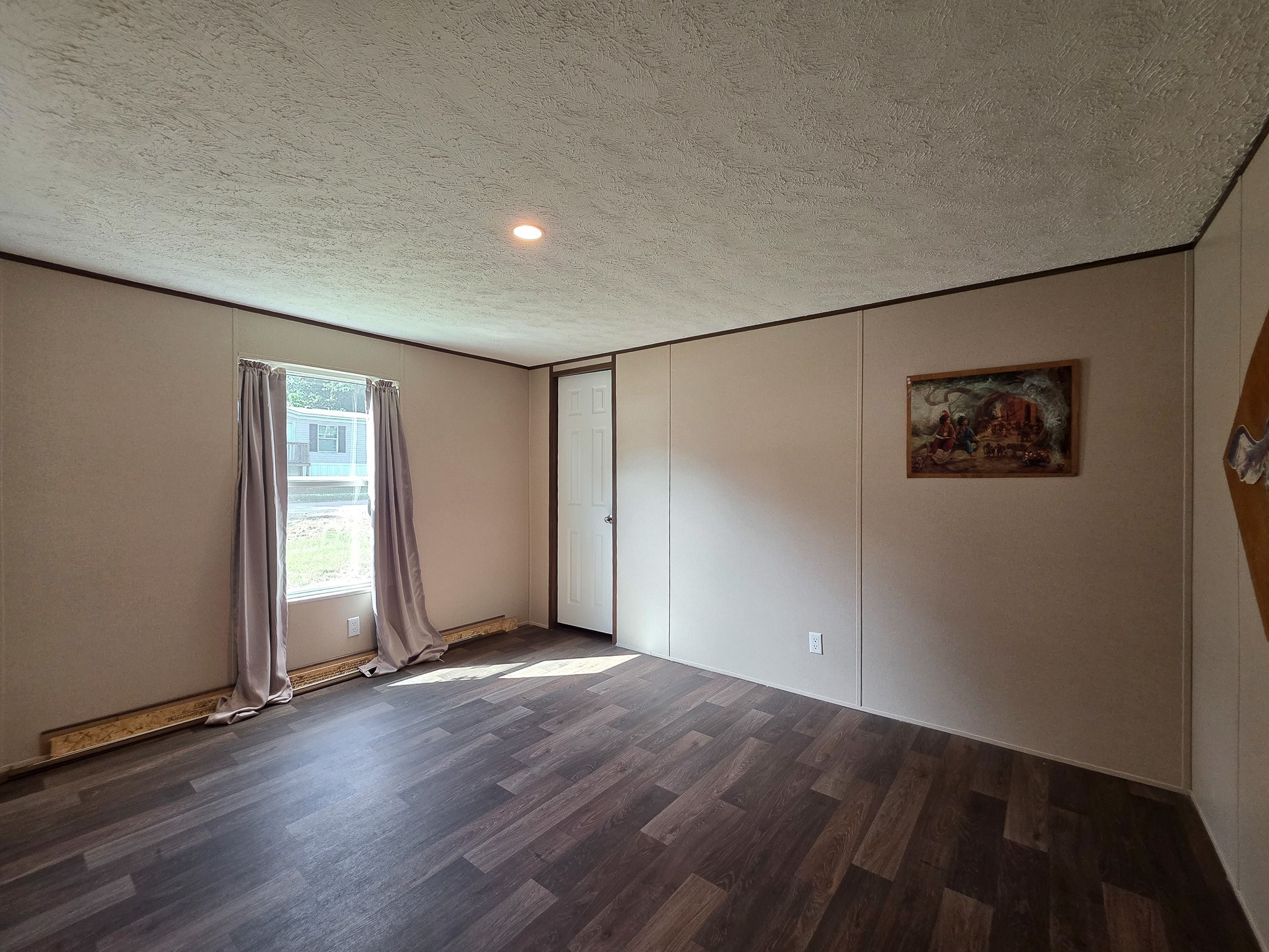 15 Great Oak Trinity, TX 75862 - Photo 8 of 13 a view of an empty room with wooden floor and a window