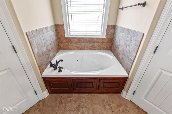 a view of a storage and utility room with washer and dryer