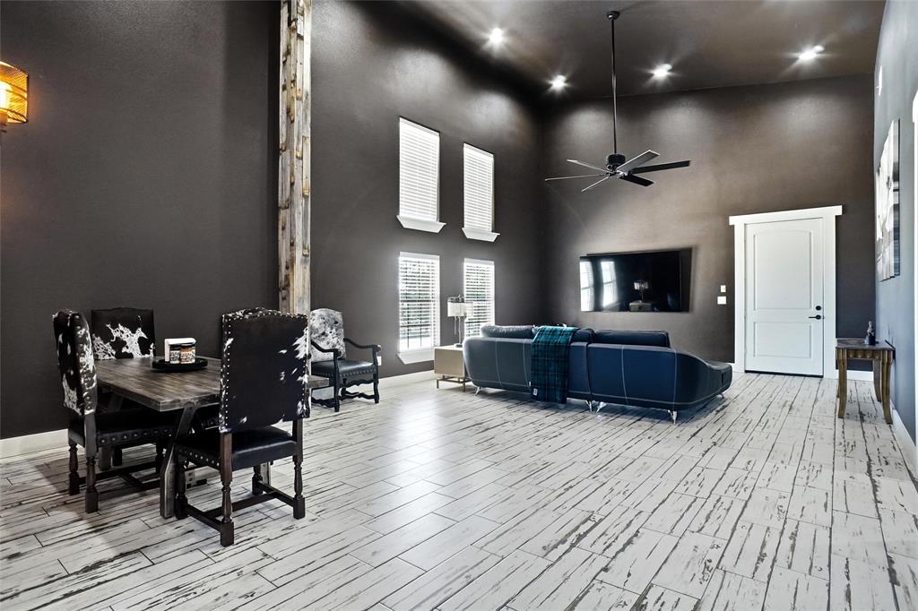 13240 Briar Road Azle, TX 76020 - Photo 26 of 39 a living room with furniture and a wooden floor