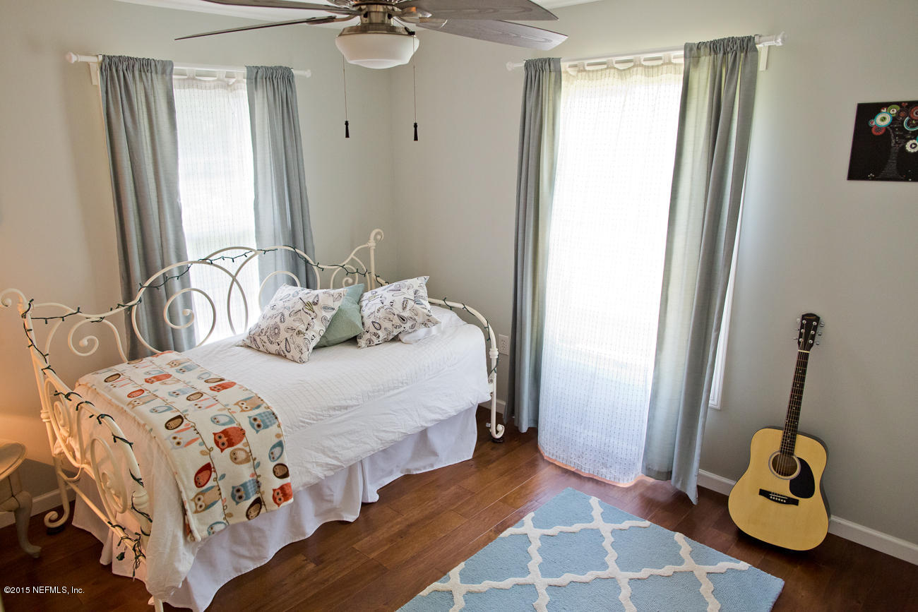 107 Saturn Road St. Augustine, FL 32086 - Photo 11 of 37 a bedroom with a bed and a window