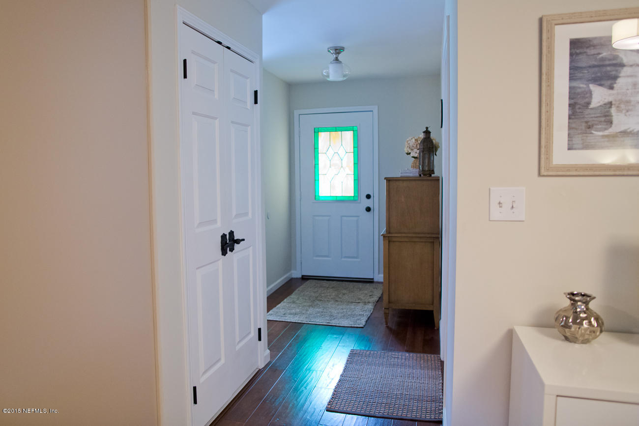 107 Saturn Road St. Augustine, FL 32086 - Photo 15 of 37 a view of a hallway with wooden floor and closet