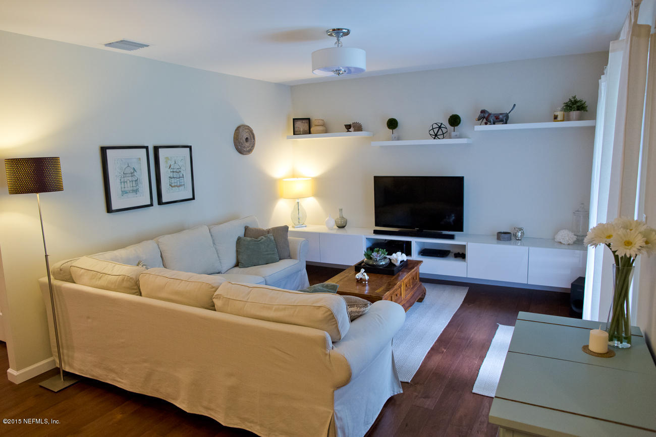 107 Saturn Road St. Augustine, FL 32086 - Photo 17 of 37 a living room with furniture and a flat screen tv