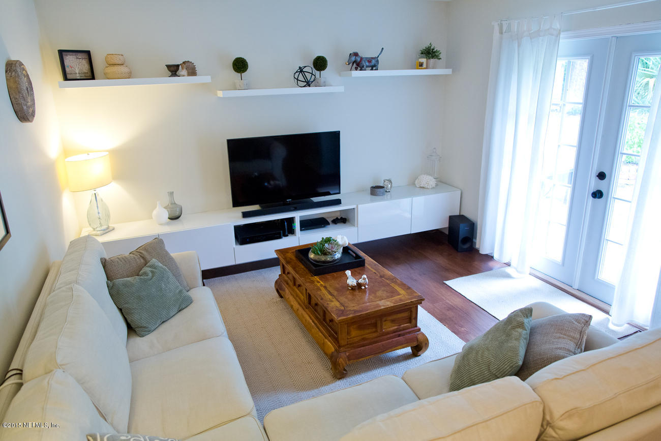 107 Saturn Road St. Augustine, FL 32086 - Photo 18 of 37 a living room with furniture and a flat screen tv