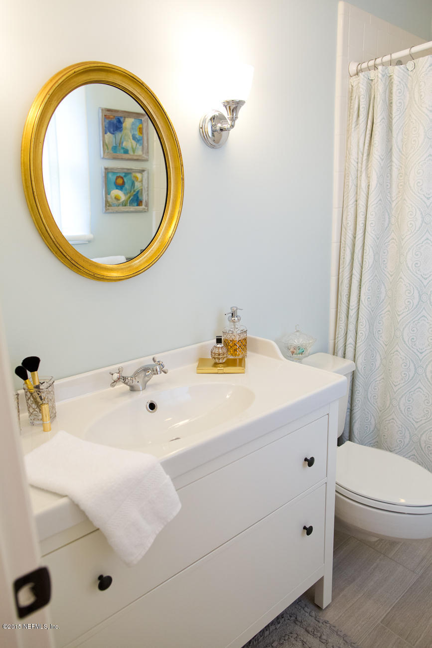 107 Saturn Road St. Augustine, FL 32086 - Photo 36 of 37 a bathroom with a sink and a mirror
