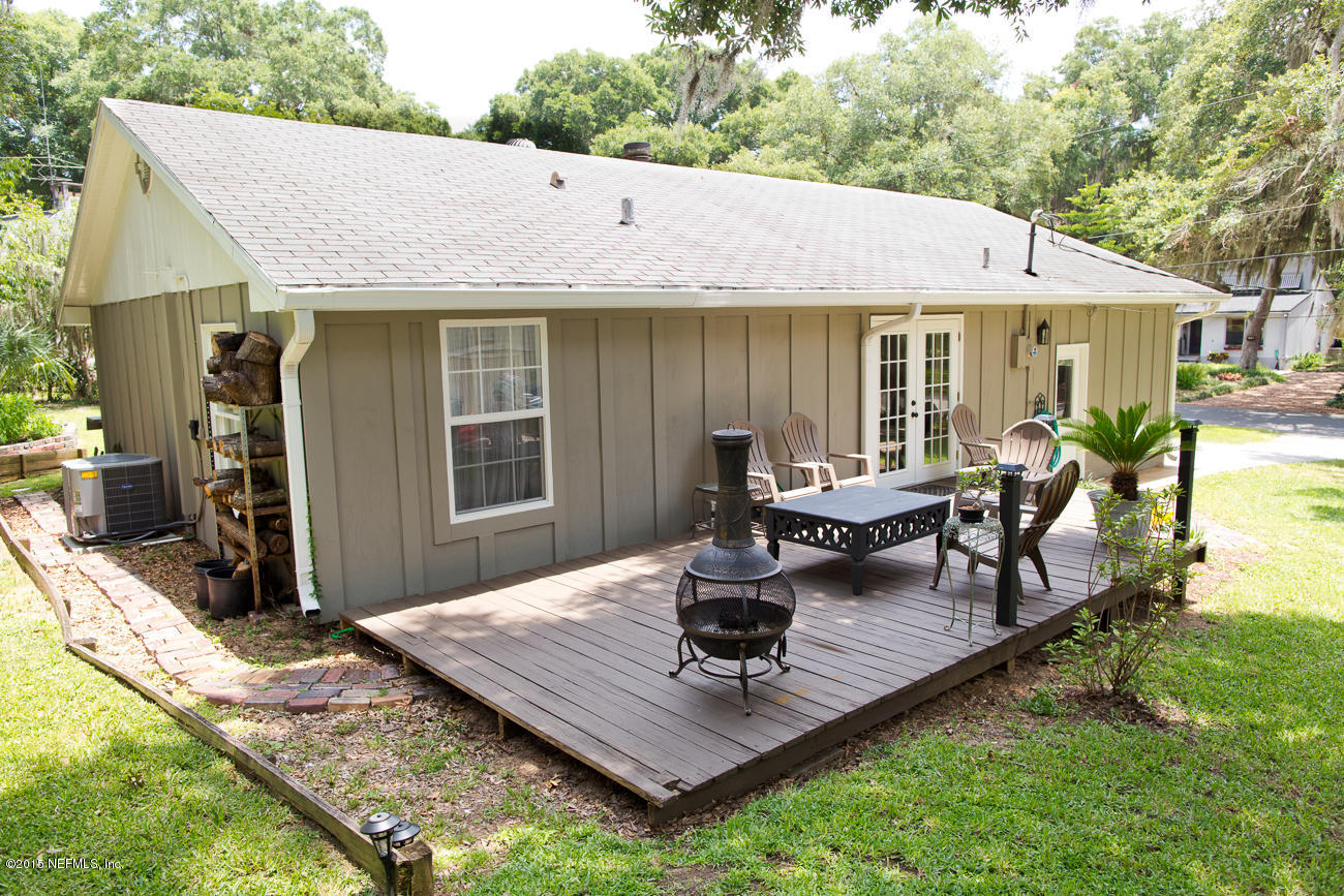 107 Saturn Road St. Augustine, FL 32086 - Photo 5 of 37 a view of a house with backyard tub and sitting area
