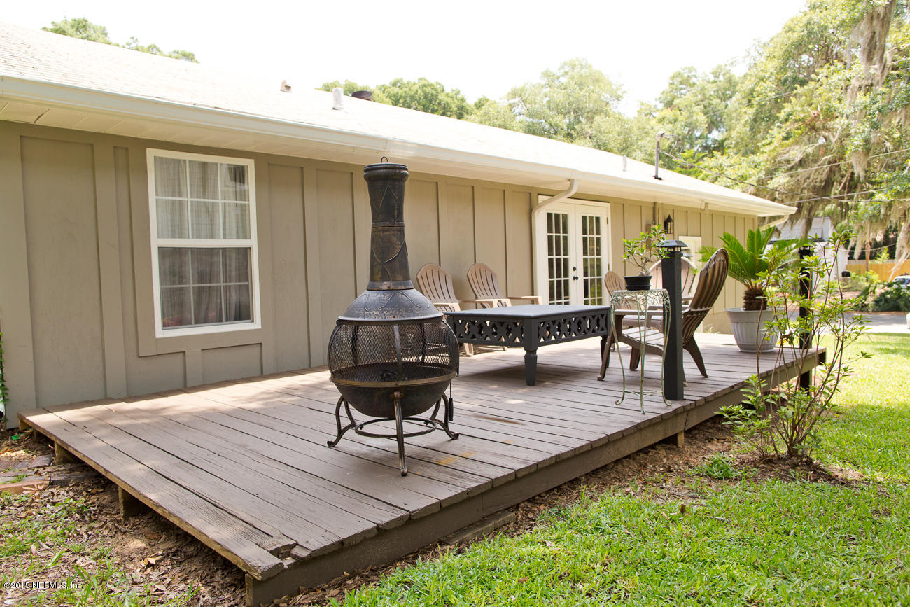 107 Saturn Road St. Augustine, FL 32086 - Photo 6 of 37 a roof deck with a table and chairs
