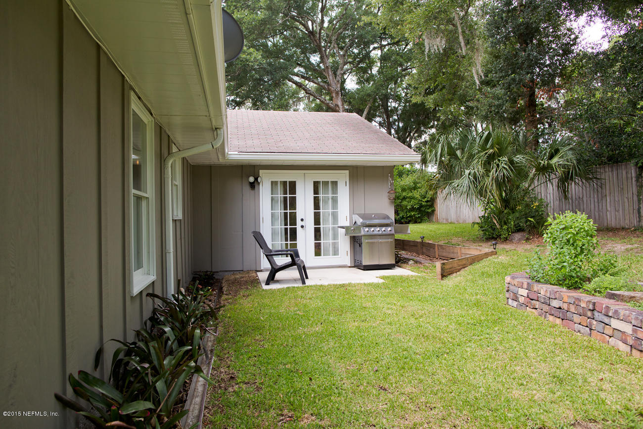 107 Saturn Road St. Augustine, FL 32086 - Photo 8 of 37 a view of a house with backyard sitting area and garden