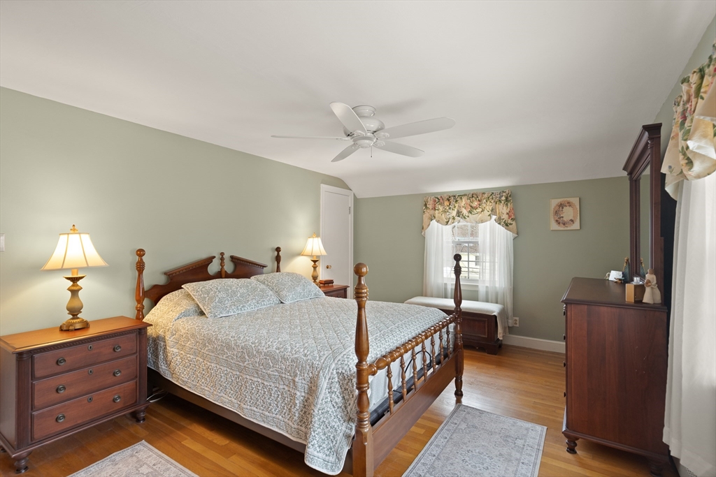 35 Longfellow Road Reading, MA 01867 - Photo 20 of 34 a bedroom with a bed and a chandelier