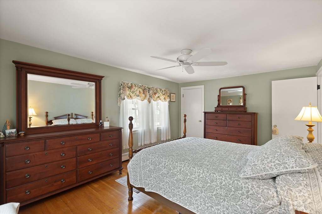 35 Longfellow Road Reading, MA 01867 - Photo 21 of 34 a bedroom with a large bed and a dresser
