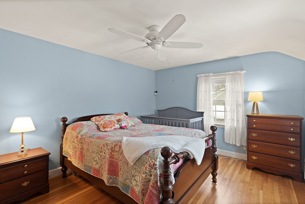 35 Longfellow Road Reading, MA 01867 - Photo 23 of 34 a bedroom with a bed and wooden floor