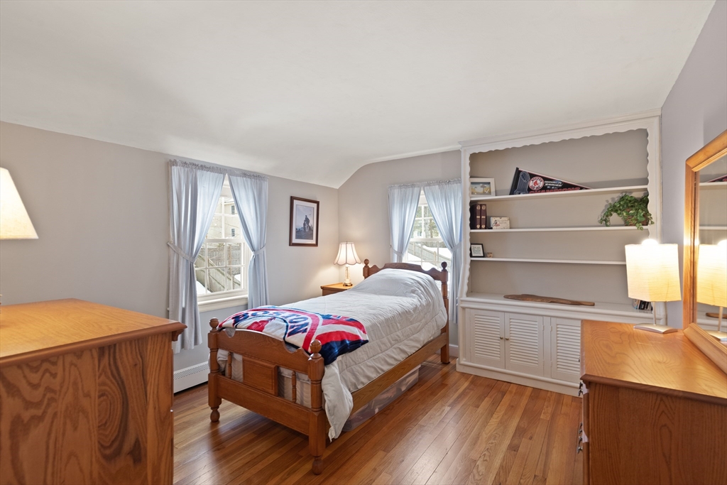 35 Longfellow Road Reading, MA 01867 - Photo 24 of 34 a bedroom with a bed and a cabinets