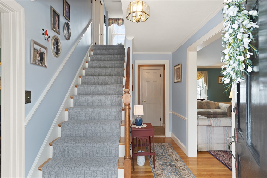 35 Longfellow Road Reading, MA 01867 - Photo 4 of 34 a view of entryway and hall with wooden floor