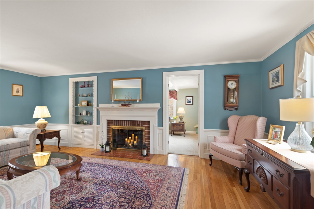 35 Longfellow Road Reading, MA 01867 - Photo 5 of 34 a living room with furniture and a fireplace