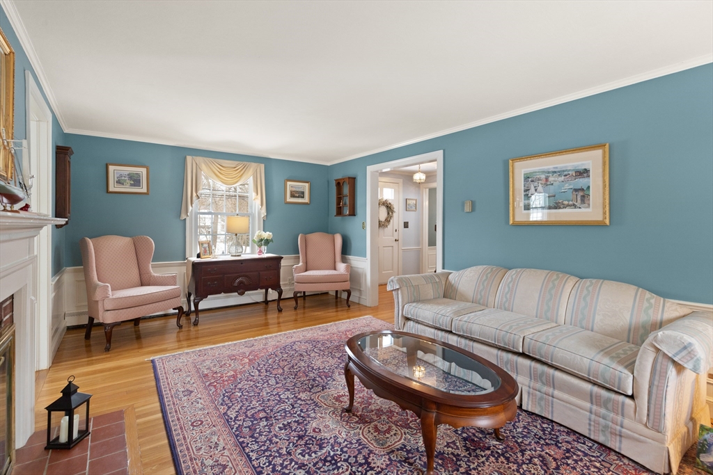35 Longfellow Road Reading, MA 01867 - Photo 7 of 34 a living room with furniture a rug a window and a lamp