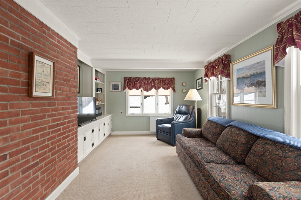 35 Longfellow Road Reading, MA 01867 - Photo 8 of 34 a living room with furniture and windows