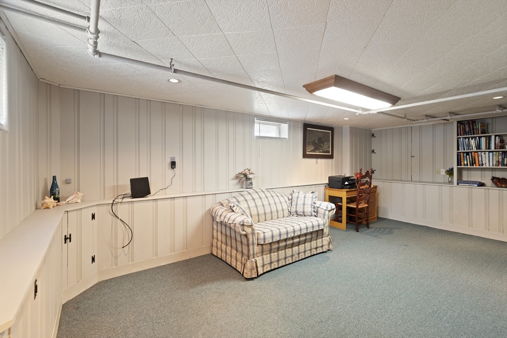 35 Longfellow Road Reading, MA 01867 - Photo 10 of 34 a spacious bedroom with a bed and a couch