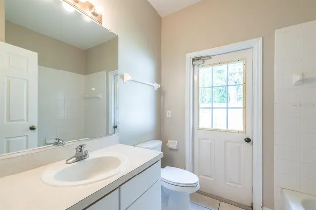 a bathroom with a sink toilet and vanity
