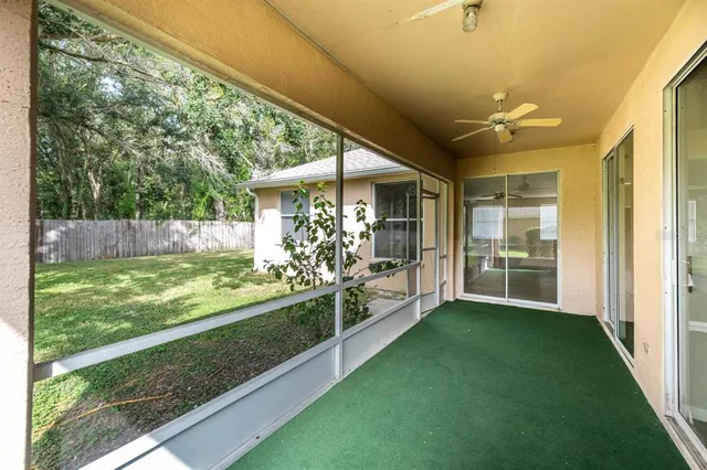 a view of a porch and garden
