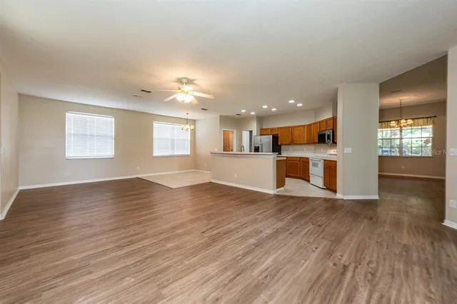 a view of kitchen with wooden floor and windows