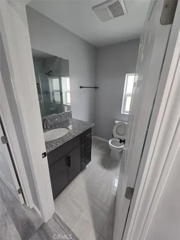 a view of a bathroom from the hallway
