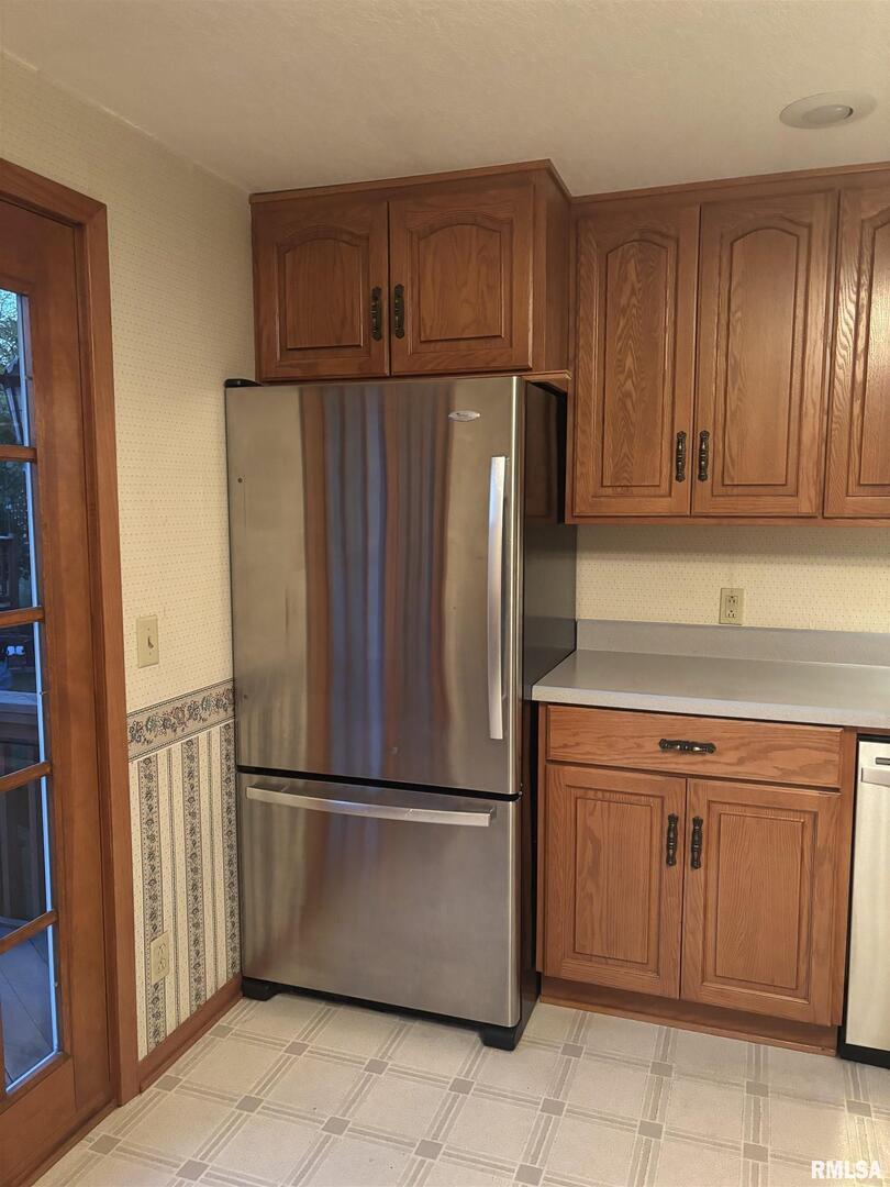 418 East Division Street Kewanee, IL 61443 - Photo 12 of 72 a kitchen with stainless steel appliances granite countertop a refrigerator and a stove