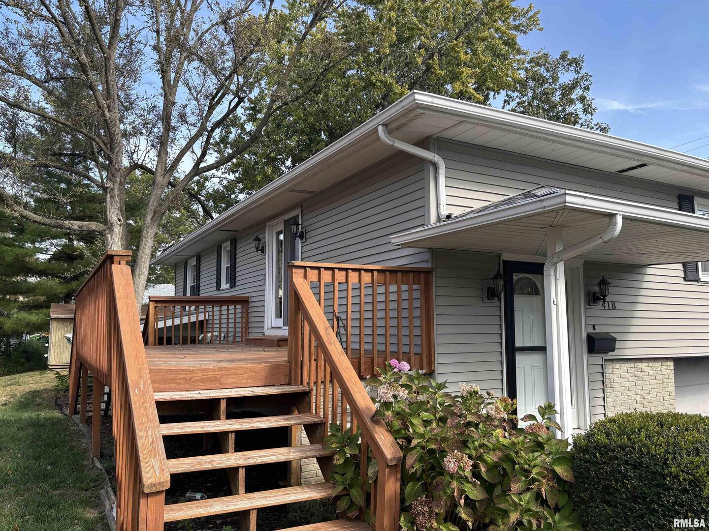 418 East Division Street Kewanee, IL 61443 - Photo 6 of 72 a front view of a house with a garden